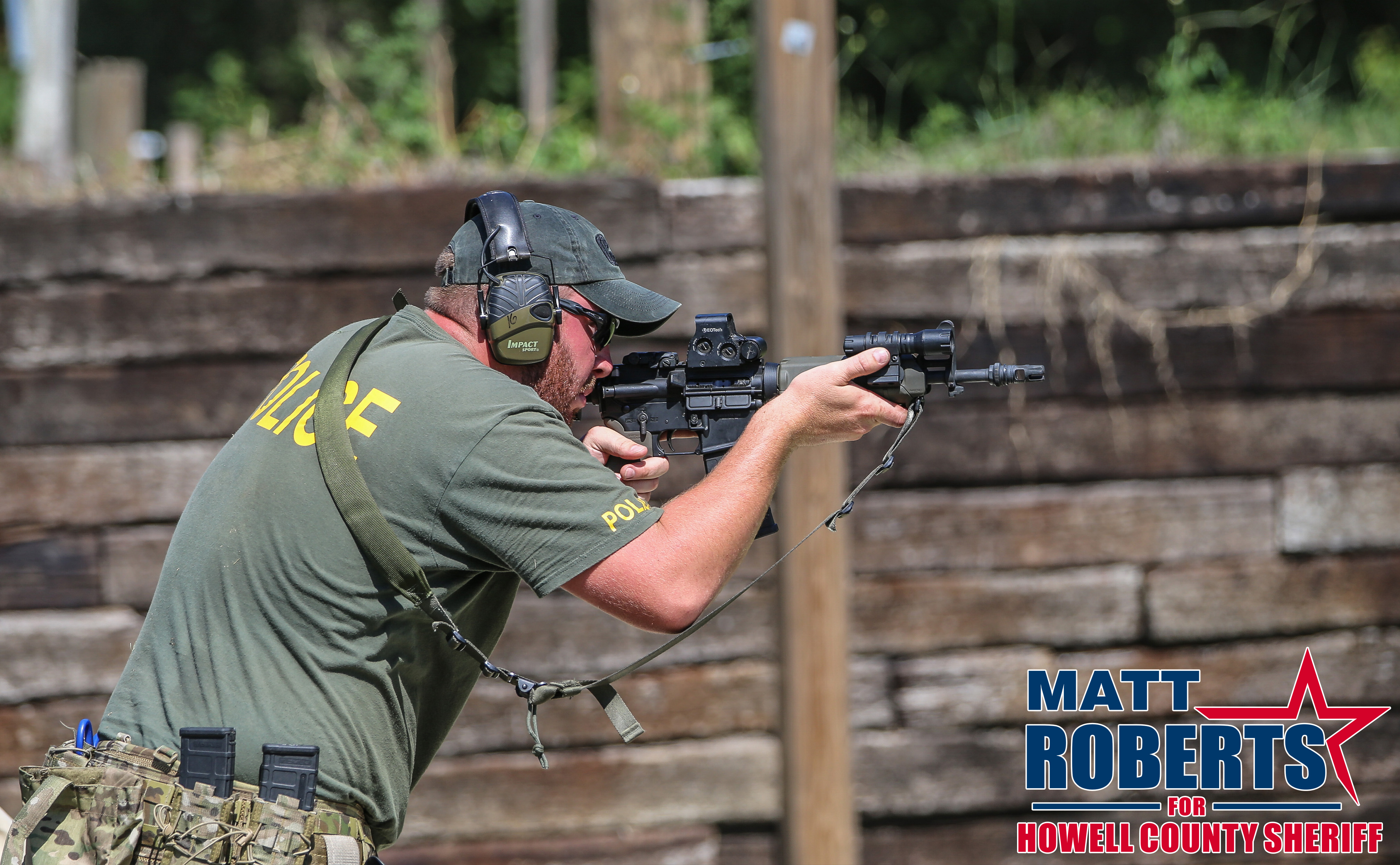 Matt Roberts at the shooting range holding a rifle.