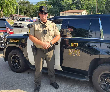 Matt Roberts next to his HCSO Patrol Car