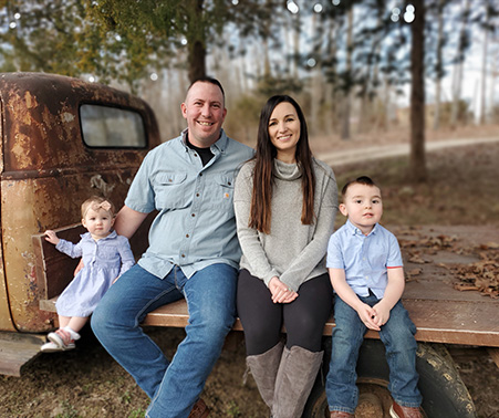 Matt Roberts with his wife and two children