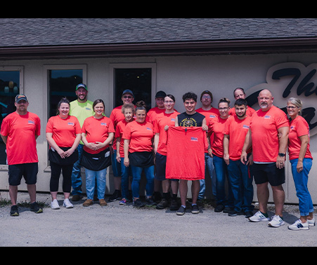 Matt Roberts with the staff of Ozark Cafe